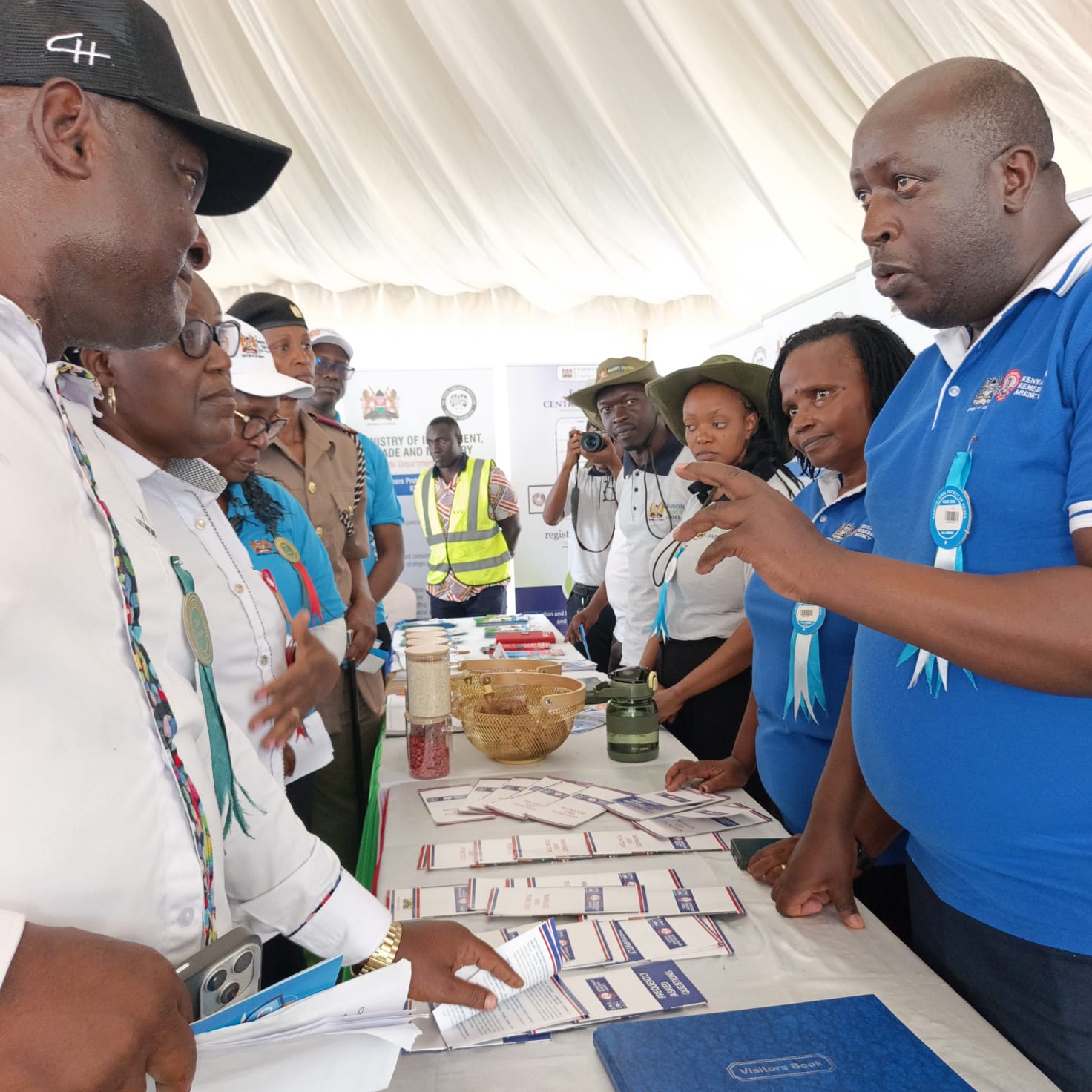 KETRA's Director of Trade Remedies Investigations and Evaluations, Mr. Daniel Wari Nderi (in the blue T-shirt), sensitizes members of the public on the Agency's mandate during the ASK National Show in Kisumu.