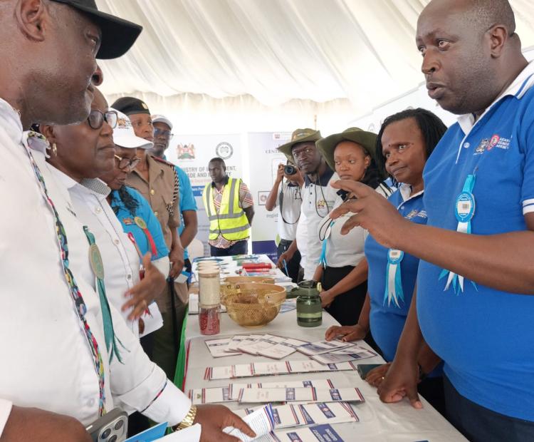 KETRA's Director of Trade Remedies Investigations and Evaluations, Mr. Daniel Wari Nderi (in the blue T-shirt), sensitizes members of the public on the Agency's mandate during the ASK National Show in Kisumu.